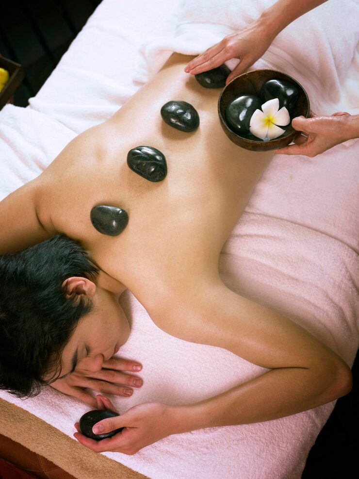 high-angle-view-woman-giving-massage-man-spa_1048944-8679858